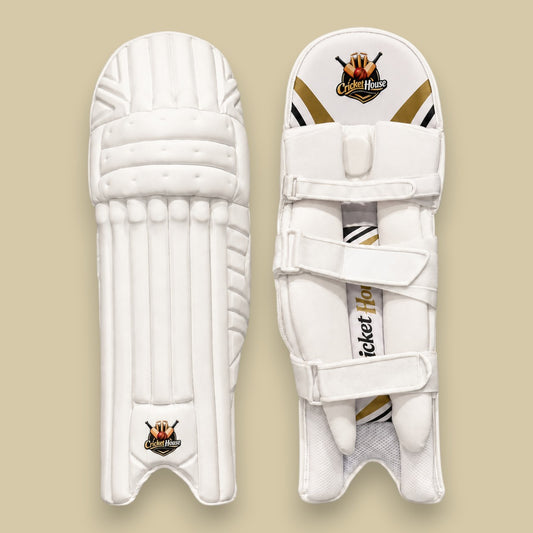 Cricket House white batting pads featuring a traditional 3-piece knee roll, triple-strap system, and side wing protection.